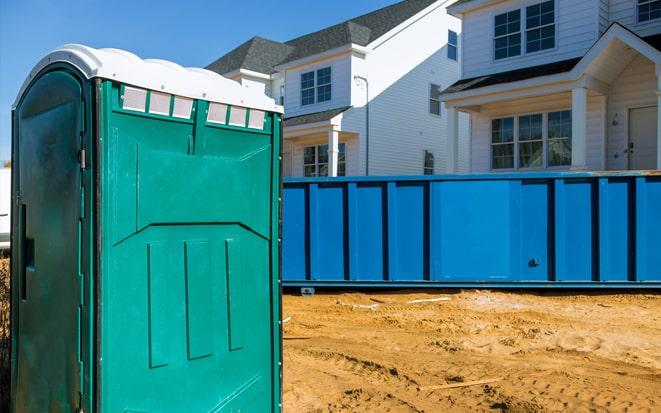 dumpster and portable toilet at a construction site project in Troy NY